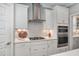 Well-equipped kitchen featuring white cabinets, subway tile backsplash, and stainless steel appliances at 8016 Parker Mill Trl, Fuquay Varina, NC 27526