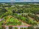 A lovely aerial view reveals lush land and the area surrounding this wonderful property at 8175 Nc 27 E, Coats, NC 27521