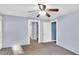 Bedroom with neutral walls, carpet flooring, and ample doorway access at 8175 Nc 27 E, Coats, NC 27521