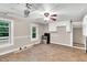 Traditional kitchen and dining area featuring a stainless-steel stove and a ceiling fan at 8175 Nc 27 E, Coats, NC 27521
