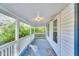 Relaxing covered porch perfect for enjoying the outdoors at 8175 Nc 27 E, Coats, NC 27521