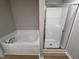 Bathroom showcasing soaker tub and shower at 86 Heatherglenn Cir, Princeton, NC 27569