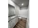 Clean and modern bathroom featuring granite countertops, white cabinets, and a shower-tub combo at 86 Heatherglenn Cir, Princeton, NC 27569