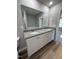 Bathroom with dual granite vanity and large mirror at 86 Heatherglenn Cir, Princeton, NC 27569
