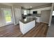 Modern kitchen with white cabinetry, a granite island, and stainless steel appliances at 86 Heatherglenn Cir, Princeton, NC 27569