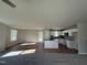 Bright kitchen featuring white cabinets, granite countertops, and stainless steel appliances at 86 Heatherglenn Cir, Princeton, NC 27569