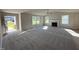 Spacious living room with a fireplace, ceiling fan, and plenty of natural light from large windows at 86 Heatherglenn Cir, Princeton, NC 27569