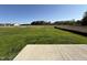 A backyard view of the expansive property with lush green grass and undeveloped land at 87 Heatherglenn Cir, Princeton, NC 27569