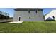 Exterior view of a two-story house showcasing the backyard and patio at 87 Heatherglenn Cir, Princeton, NC 27569