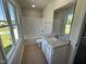 Bathroom with granite countertop, tile flooring, and view of the combination shower and tub at 87 Heatherglenn Cir, Princeton, NC 27569