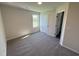 Cozy bedroom with plush carpeting, a window with a view, and white trim at 87 Heatherglenn Cir, Princeton, NC 27569
