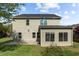 Two-story home featuring neutral siding, a dark roof, well-maintained lawn, and a sunroom addition at 8812 Forester Ln, Apex, NC 27539