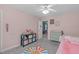 Charming bedroom features carpet floors, a dresser, and access to the ensuite bathroom at 8812 Forester Ln, Apex, NC 27539