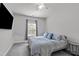 Cozy bedroom featuring natural light, carpet flooring, and soft, neutral colors at 8812 Forester Ln, Apex, NC 27539