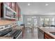 This kitchen features stainless appliances, granite counters, and a dining area with a chandelier at 8812 Forester Ln, Apex, NC 27539