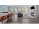 Open concept living room featuring sleek floors and a cozy fireplace at 8812 Forester Ln, Apex, NC 27539