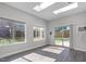 Sunlit sun room with skylights, multiple windows, and access to the private backyard space at 8812 Forester Ln, Apex, NC 27539