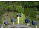 An aerial view showing the approximate property lines of the home, surrounded by lush greenery and trees at 9220 Yardley Town Dr, Wake Forest, NC 27587