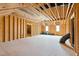 Spacious unfinished basement featuring exposed beams and framing ready for customization at 9220 Yardley Town Dr, Wake Forest, NC 27587