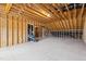 Unfinished basement with wood framing and exposed beams awaiting customization to your liking at 9220 Yardley Town Dr, Wake Forest, NC 27587