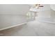 This bonus room features plush carpeting and natural light from the windows at 9220 Yardley Town Dr, Wake Forest, NC 27587