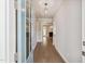 Inviting entryway featuring hardwood floors and a clear view into the living room with a fireplace at 9220 Yardley Town Dr, Wake Forest, NC 27587