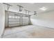 Clean, spacious two car garage with white walls and concrete floor ready for vehicles and storage at 9220 Yardley Town Dr, Wake Forest, NC 27587