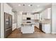 Modern kitchen featuring stainless steel appliances, granite countertops, and white cabinetry at 9220 Yardley Town Dr, Wake Forest, NC 27587