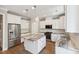 Bright kitchen features stainless appliances, white cabinets, subway tile backsplash and granite countertops at 9220 Yardley Town Dr, Wake Forest, NC 27587