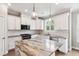 Modern kitchen with granite countertops, stainless steel appliances, and ample storage space at 9220 Yardley Town Dr, Wake Forest, NC 27587