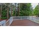 A cozy wooden deck that is elevated for overlooking the lovely trees and wooded area at 9531 Vira Dr, Raleigh, NC 27617