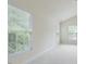 Bright bedroom with large windows offering pleasant outdoor views and neutral carpet at 9531 Vira Dr, Raleigh, NC 27617