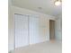 Bedroom featuring a double-door closet at 9531 Vira Dr, Raleigh, NC 27617