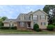 Beautiful two-story home with green shutters and meticulous landscaping at 9531 Vira Dr, Raleigh, NC 27617