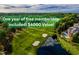 Beautiful aerial view of the golf course with a pond, mature trees, and free membership included at 9531 Vira Dr, Raleigh, NC 27617
