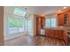 Bright kitchen with hardwood floors, stainless steel appliances, a skylight, and a breakfast nook with windows at 9531 Vira Dr, Raleigh, NC 27617