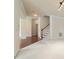 Spacious open-concept area with hardwood floors, neutral walls, and staircase at 9531 Vira Dr, Raleigh, NC 27617