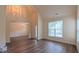Inviting living area featuring hardwood floors, high ceilings, and abundant natural light at 9531 Vira Dr, Raleigh, NC 27617
