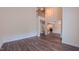 Spacious room showcasing hardwood floors and an open floorplan to the 2nd story at 9531 Vira Dr, Raleigh, NC 27617