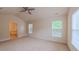 Large primary bedroom with vaulted ceiling, a ceiling fan, and an ensuite bathroom at 9531 Vira Dr, Raleigh, NC 27617