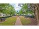 Community playground featuring a modern play structure, picnic tables and mature trees offering shade for outdoor activities at 9531 Vira Dr, Raleigh, NC 27617