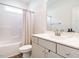 Bright bathroom with shower-tub combination, modern fixtures, and a sleek white vanity at 96 Ada Cir, Selma, NC 27576