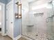 Modern bathroom features a glass-enclosed shower with a decorative stone floor at 96 Ada Cir, Selma, NC 27576
