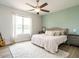 Cozy main bedroom with a calming color palette, ceiling fan, and natural light at 96 Ada Cir, Selma, NC 27576