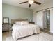 Comfortable main bedroom features a sliding barn door leading to the ensuite bath at 96 Ada Cir, Selma, NC 27576