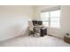 Bright office space with large window, neutral carpet, and computer setup at 96 Ada Cir, Selma, NC 27576