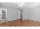 Bright bedroom offering hardwood floors and an ensuite bathroom with a tiled shower at 1005 Greenwood Cir, Cary, NC 27511