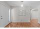 Bright entryway with hardwood floors, white walls, a pendant light and views of the home's interior at 1005 Greenwood Cir, Cary, NC 27511