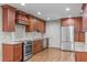 Updated kitchen with granite countertops, stainless steel appliances, and ample cabinet space at 1005 Greenwood Cir, Cary, NC 27511