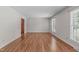 Sunlit living room featuring hardwood floors and view of the outdoors at 1005 Greenwood Cir, Cary, NC 27511